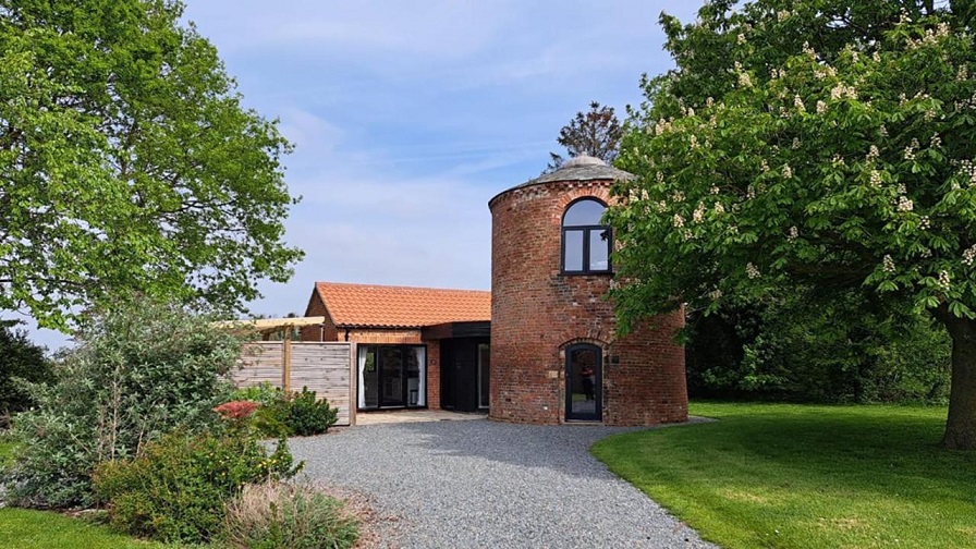 A fully renovated dovecote on Waite Farm in Thornton in Lincolnshire in the UK, now luxury accommodation.