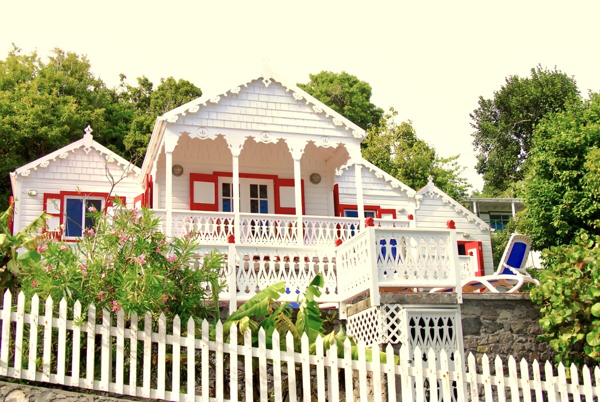 Flamboyant Cottage Saba Island in Caribbean, known as the 'Gingerbread Cottage'.
