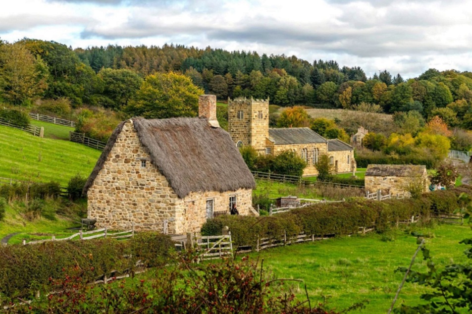 A stone cottage on the edge of a small village in the rolling hills of the UK