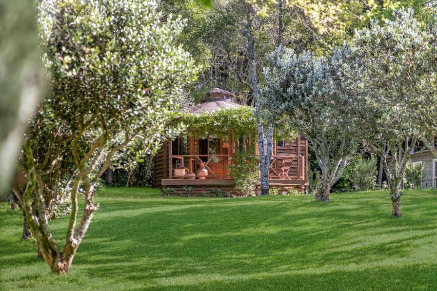 The private 'Lothlorien Yurt' sits next to the forest in the Kangaroo Valley, NSW in Australia.